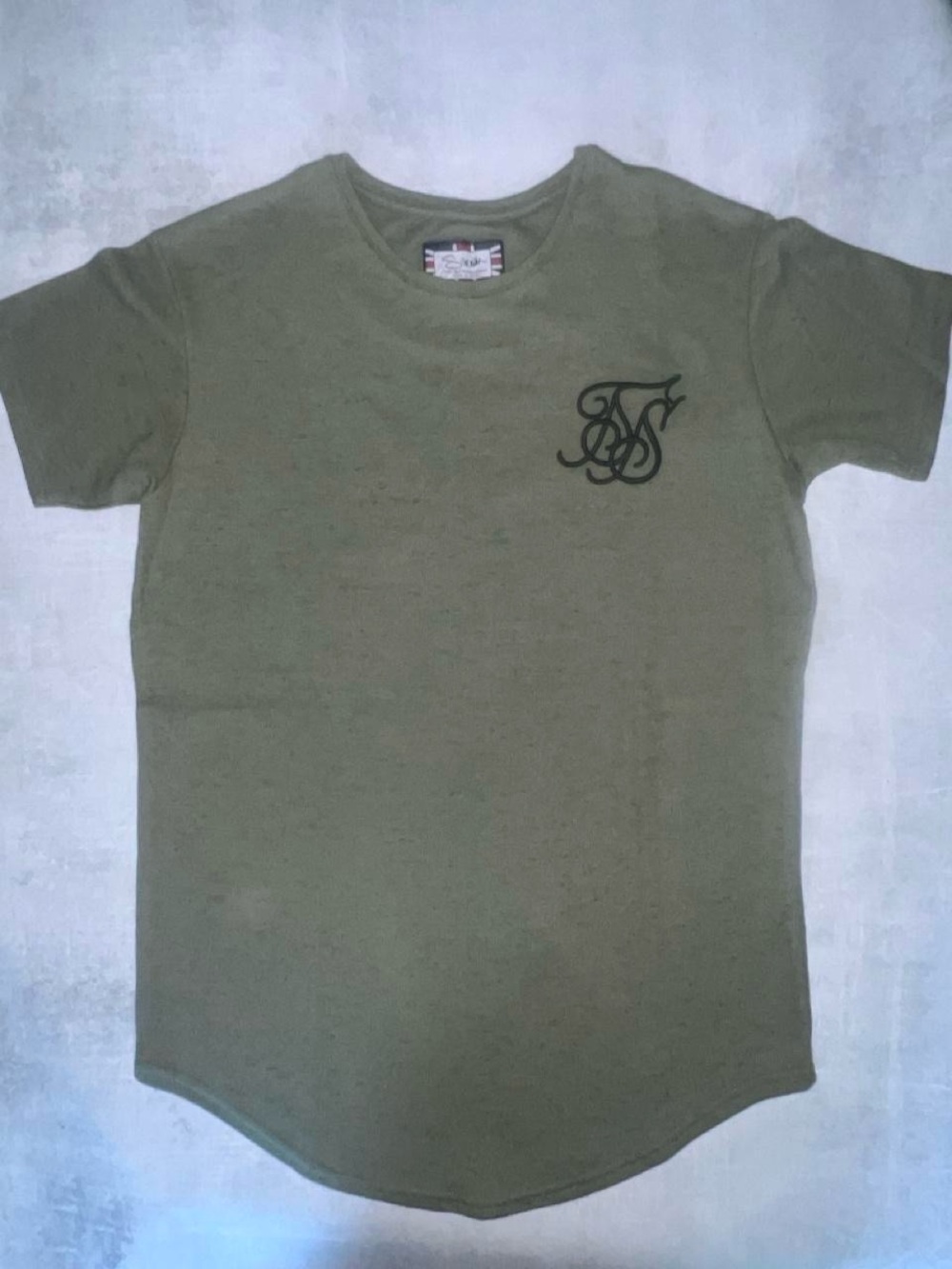 New With Tags SikSilk t-shirt featuring a signature raglan sleeve design